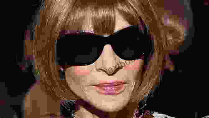 Anna Wintour In A Stylish Black Dress With Sunglasses Perched On Her Hair, A Signature Pose Symbolizing Her Authority In The Fashion World. Anna: The Biography Amy Odell